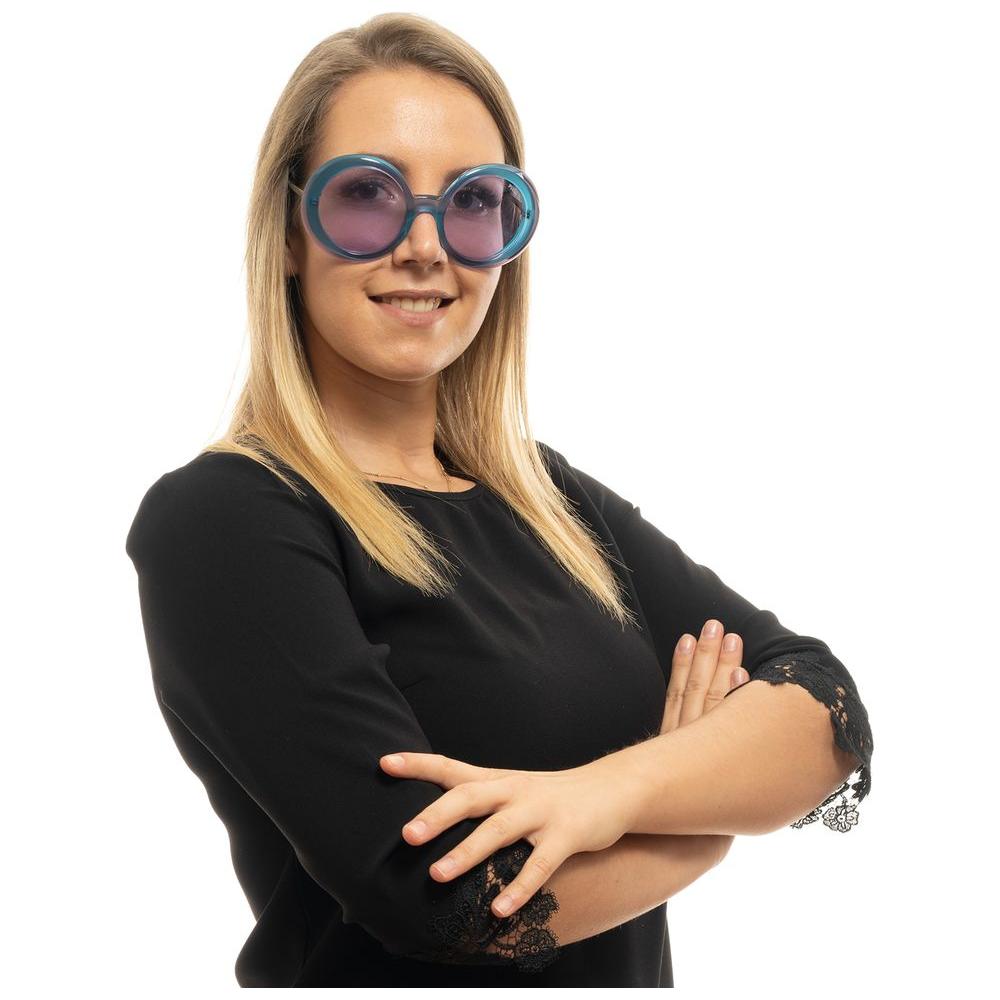 Woman wearing Emilio Pucci turquoise sunglasses with purple lenses in a round, full-rim style.