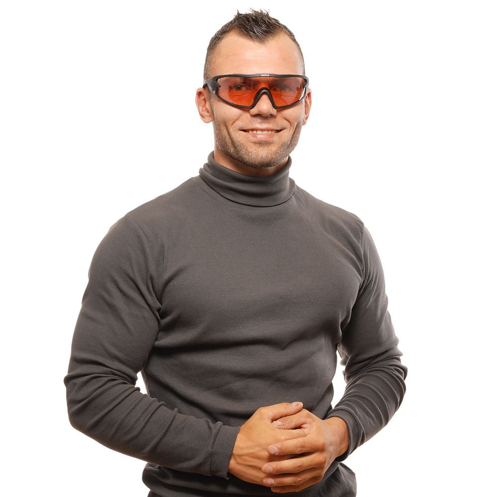 Person wearing Bolle black unisex sunglasses with rose mirrored lenses and full-rim frame, modeling protective eyewear.