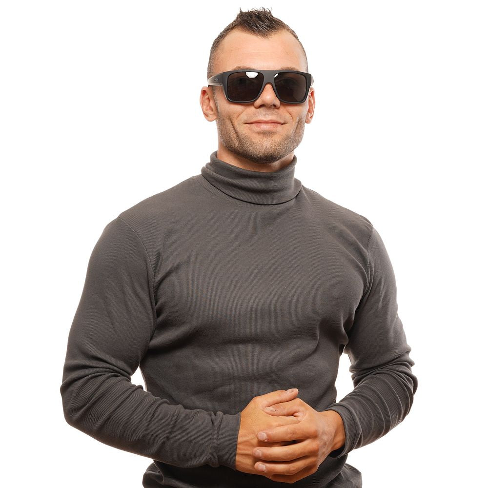 Man wearing Bolle black unisex sunglasses with polarized grey lenses and full-rim black plastic frame, 100% UVA & UVB protection.
