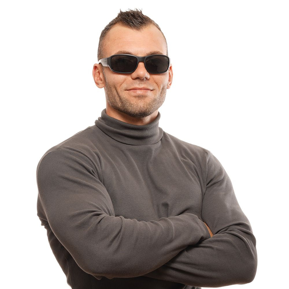 Person wearing Bolle Black Unisex Rectangle Sunglasses with grey lenses and full-rim black plastic frame.