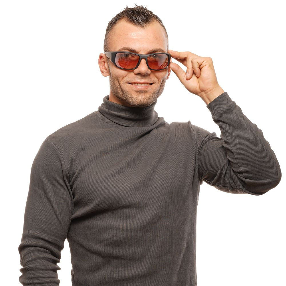 Person wearing Bolle Black Unisex Sunglasses with mirrored brown lenses, showcasing the stylish full-rim black plastic frame and UVA/UVB protection.