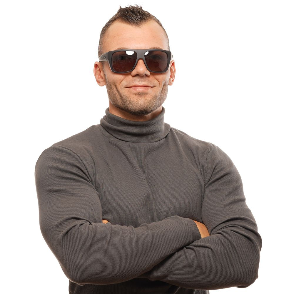 Man wearing Bolle Black Unisex Sunglasses with rectangle frame, posing in a dark turtleneck against a white background.