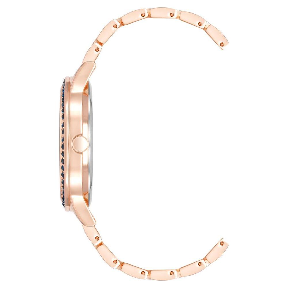 Side view of Juicy Couture rose gold women's watch with rhinestone facing and metal strap, fashion style analog display.