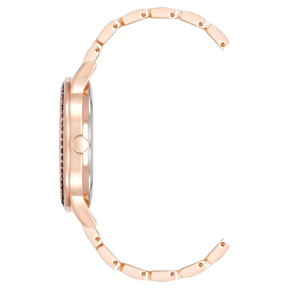 Side view of Juicy Couture Rose Gold Women's Watch with metal wristband, showcasing quartz clockwork and analog display.