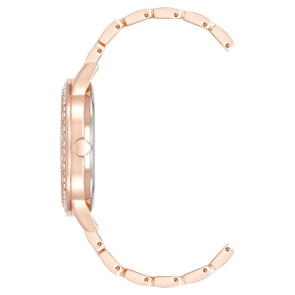 Side view of Juicy Couture rose gold women's watch with quartz movement and rhinestone face, metal strap and folding clasp.