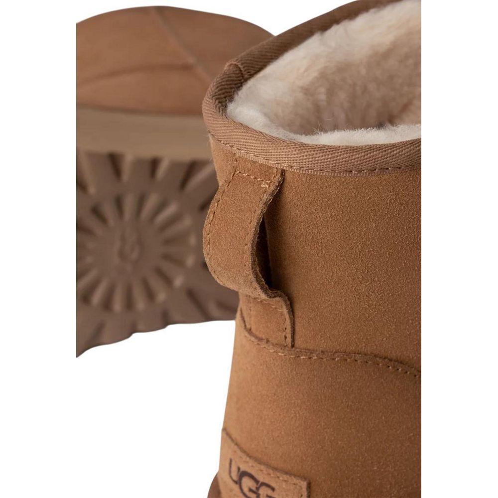 Close-up of UGG beige suede leather boot with shearling lining and durable sole, part of women's Fall/Winter collection.