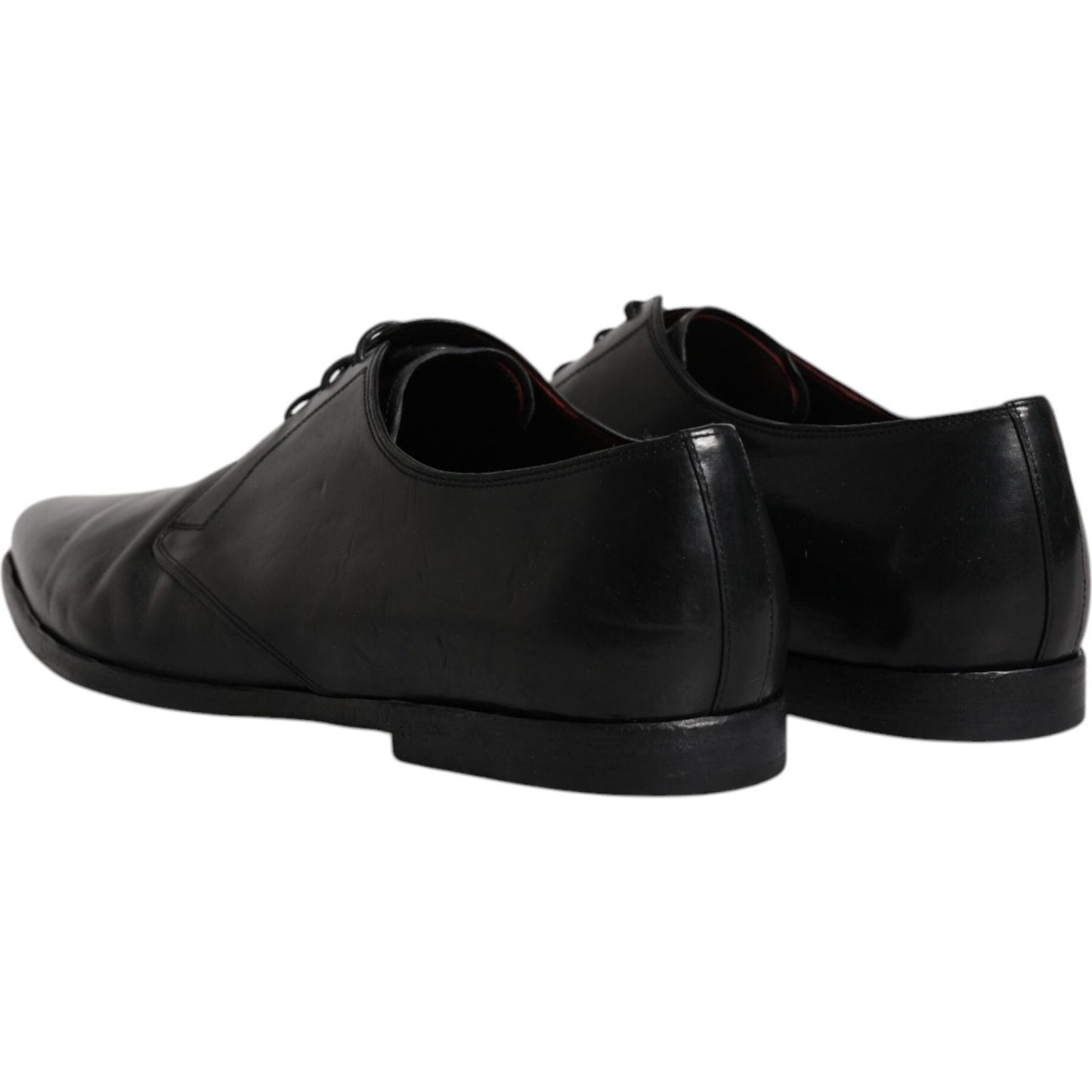 Dolce & Gabbana black leather derby shoes, elegant lace-up design, calf leather with logo details, slightly preowned, rear view.