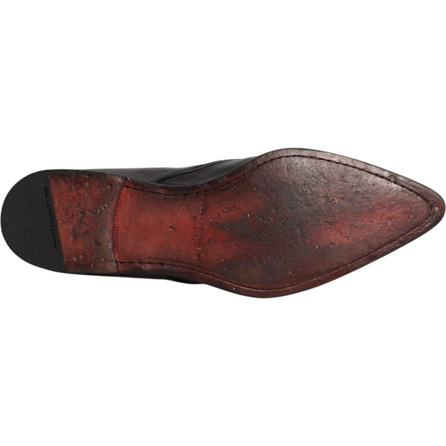 Dolce & Gabbana black leather derby shoe sole, featuring lace-up design and high craftsmanship. Slight wear on the red leather sole. Made in Italy.