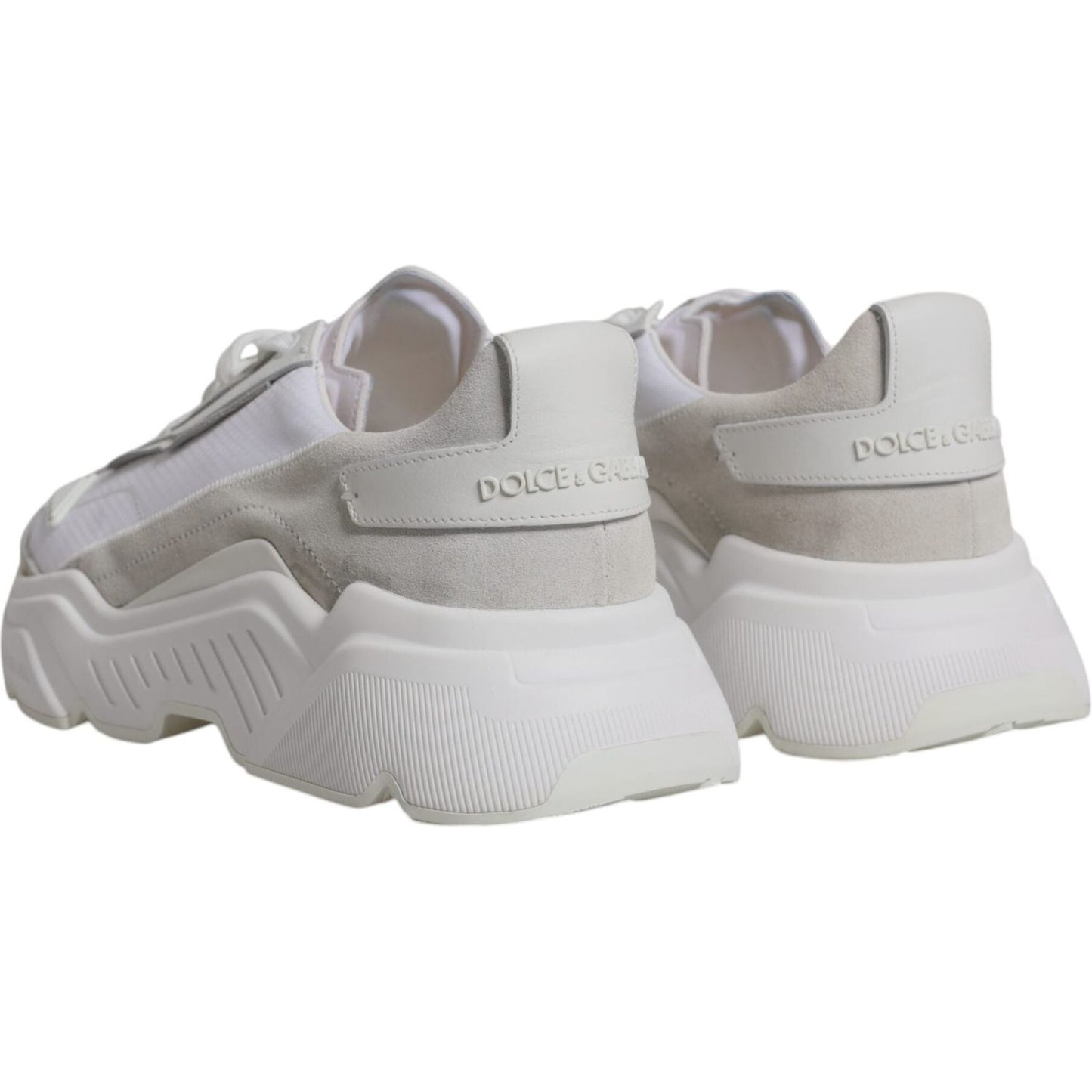 Dolce & Gabbana White Leather Daymaster Low Top Sneakers with rubber sole, logo details, and lace-up closure. Store sample image.