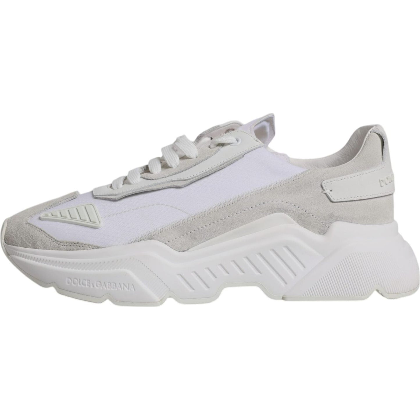 Dolce & Gabbana White Leather Daymaster Low Top Sneaker with rubber sole and logo details, featuring lace-up closure. Elegant and exclusive design.