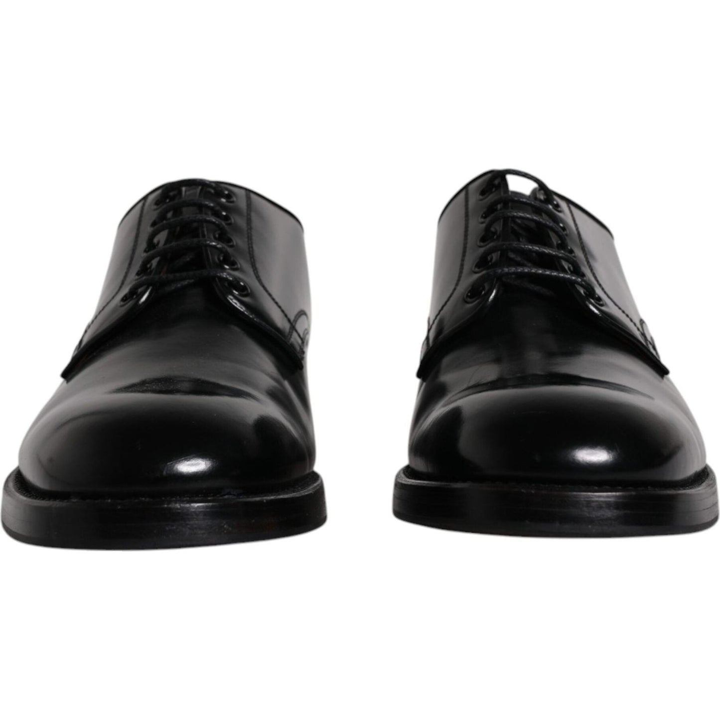 Dolce & Gabbana black leather derby shoes for men, featuring lace-up closure and logo details, front view. High craftsmanship, store sample.