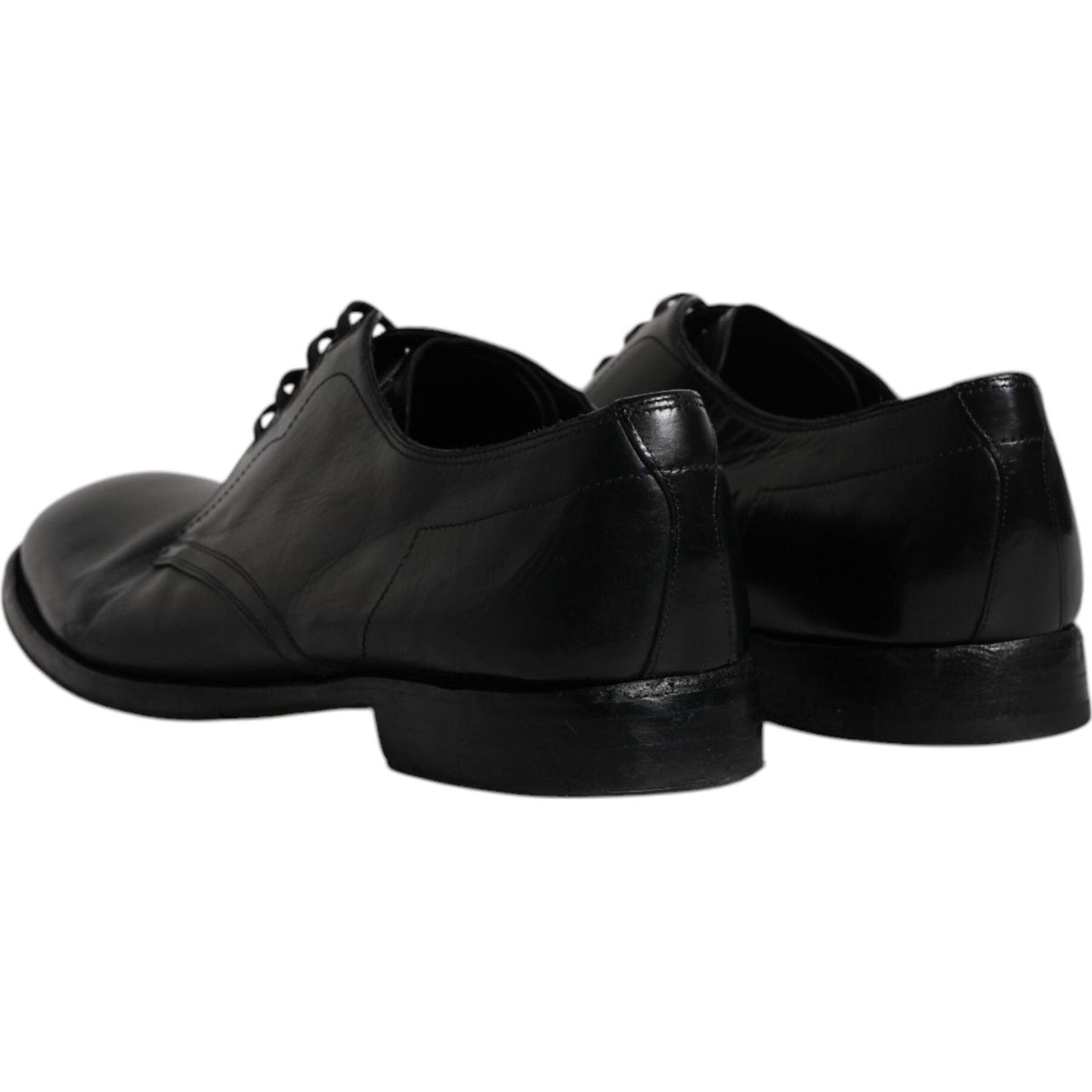 Dolce & Gabbana black leather Derby shoes, elegant design, lace-up closure, men's formal footwear, slightly preowned, back view.