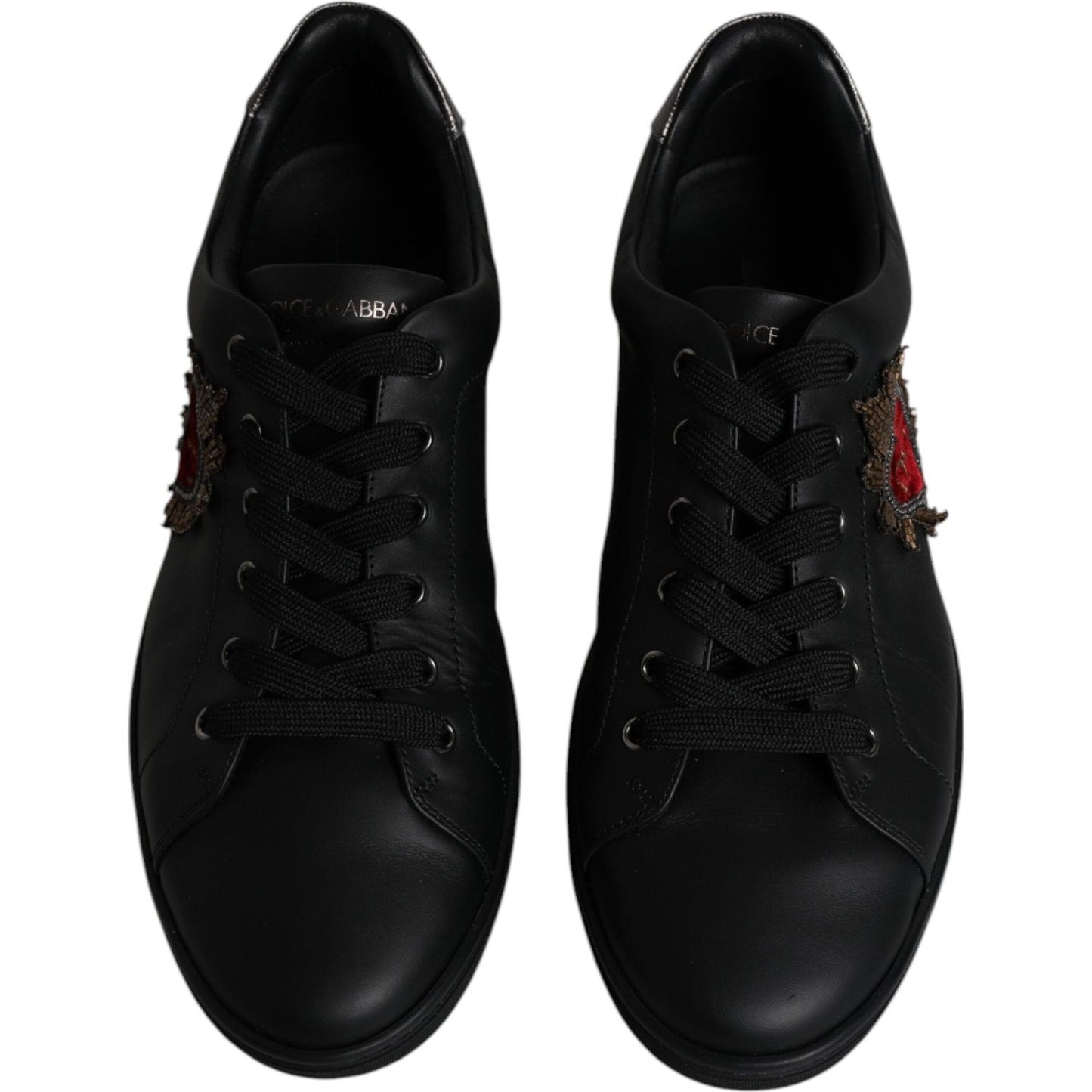Dolce & Gabbana black leather sneakers with red heart detail and lace-up closure, rubber sole. Luxury men's footwear, made in Italy.