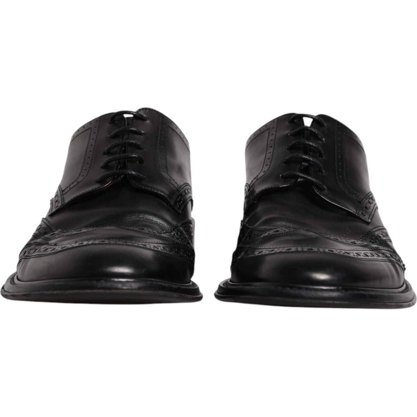 Dolce & Gabbana black leather derby wingtip formal shoes with lace-up closure, crafted from 100% calfskin leather, front view.