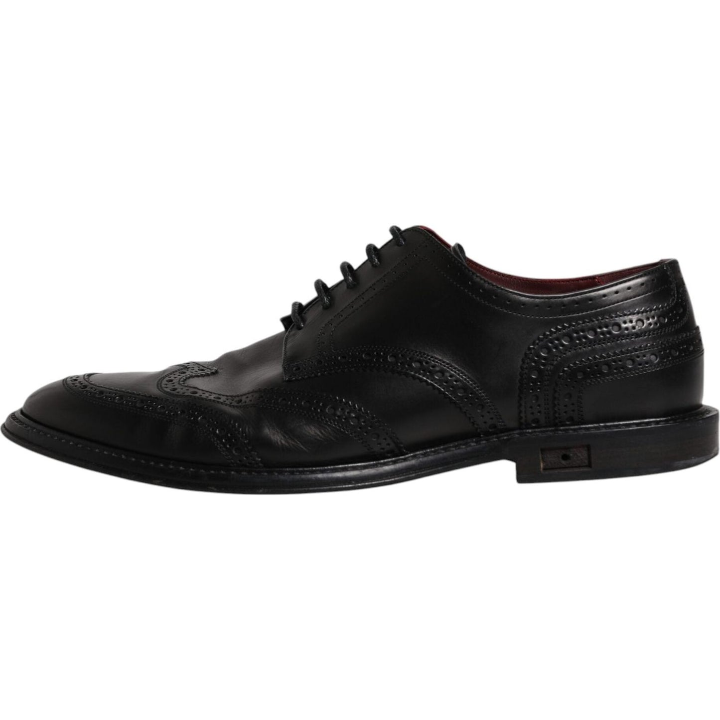 Dolce & Gabbana black leather wingtip Derby shoes, Italian craftsmanship, lace-up, calfskin, preowned with missing logo detail.