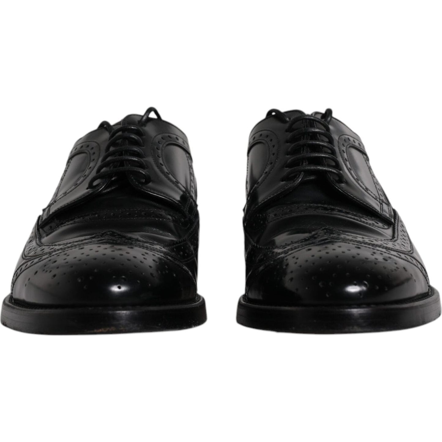 Dolce & Gabbana black leather derby wingtip formal shoes, made from calfskin leather, featuring lace-up closure and logo details.