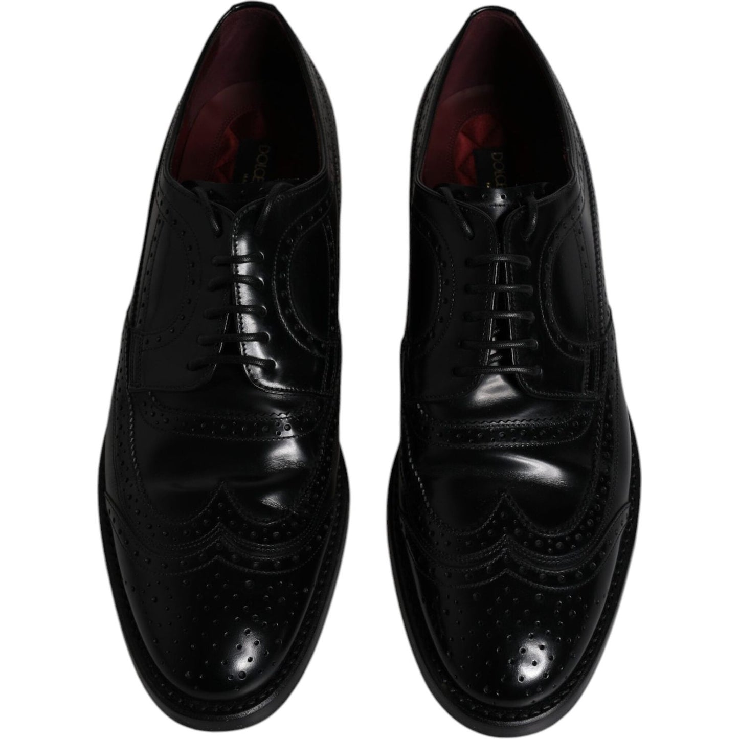 Dolce & Gabbana black leather derby wingtip shoes with lace-up closure, crafted from calfskin; made in Italy, elegant formal footwear.