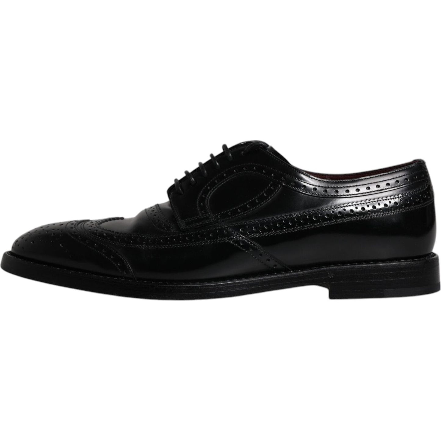 Dolce & Gabbana black leather derby wingtip formal shoes, 100% calfskin, lace-up, Italian craftsmanship, minor marks, side view.