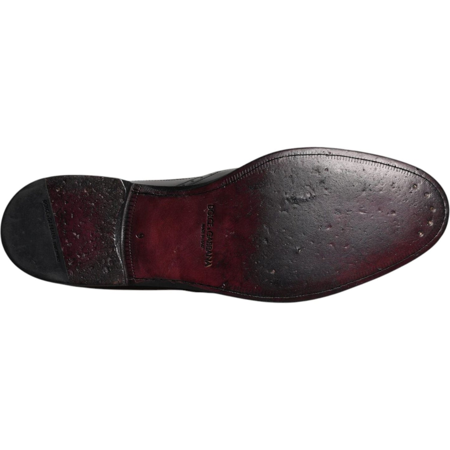 Sole view of Dolce & Gabbana black leather derby wingtip formal shoes showing craftsmanship and fine leather details.