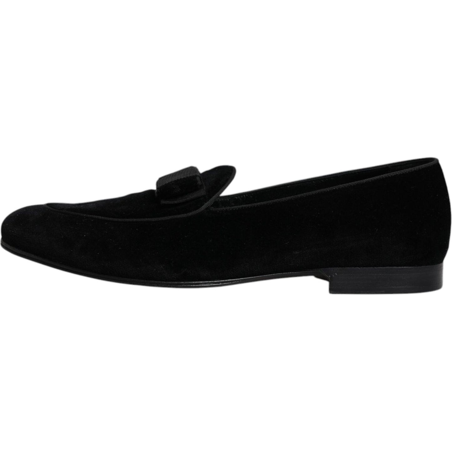 Dolce & Gabbana black velvet loafers for men, featuring a sleek design and leather outer sole. Perfect for formal wear. Made in Italy.