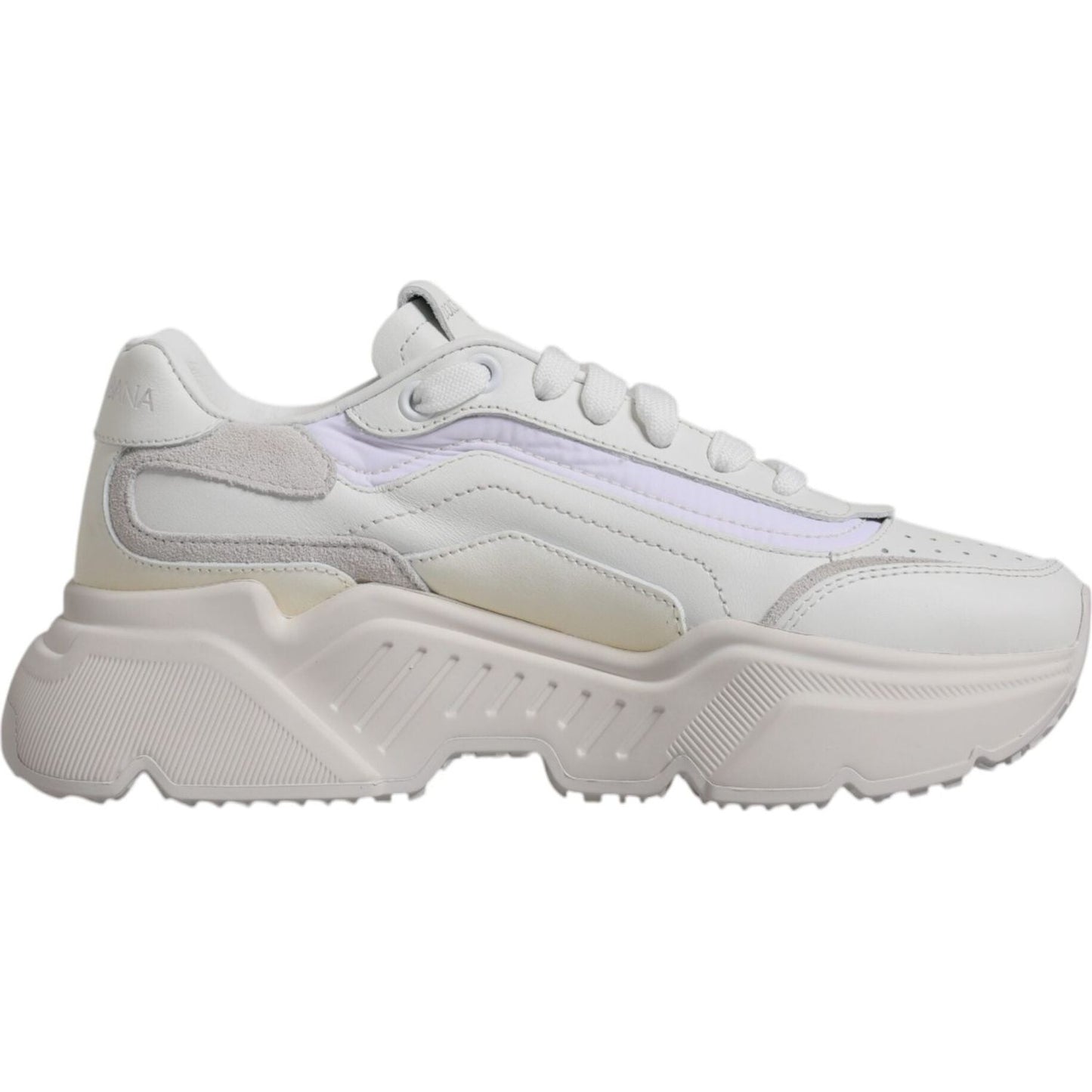 Dolce & Gabbana white Daymaster low-top sneaker with logo details, featuring a rubber sole, lace-up closure, and minor discolorations.