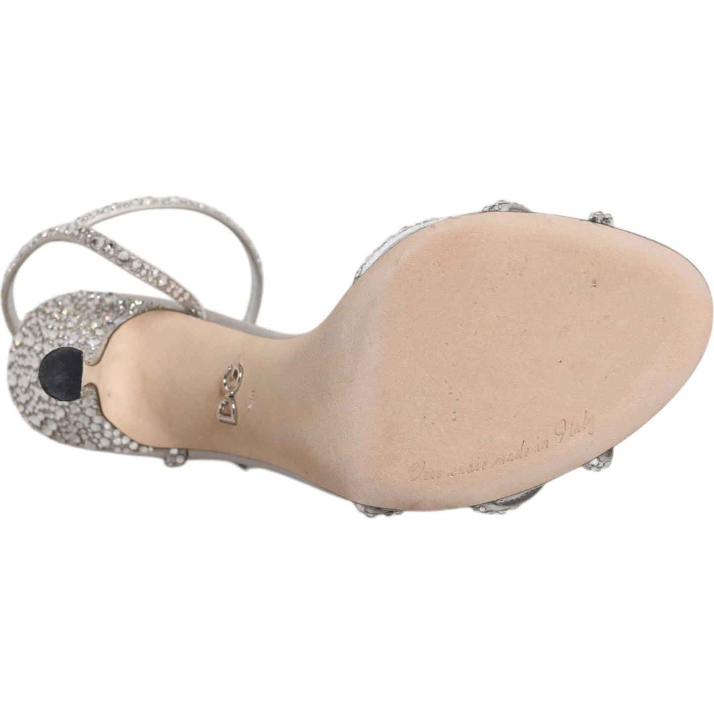 Sole view of Dolce & Gabbana silver crystal ankle strap sandal showing leather sole and logo details.