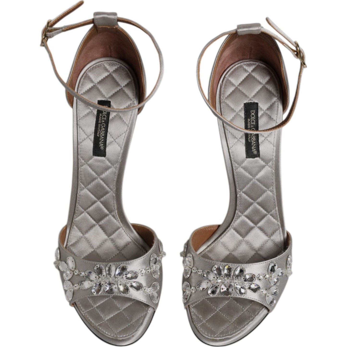 Dolce & Gabbana silver ankle strap sandals with crystal embellishments, leather sole, and buckle closure; elegant and stylish design.