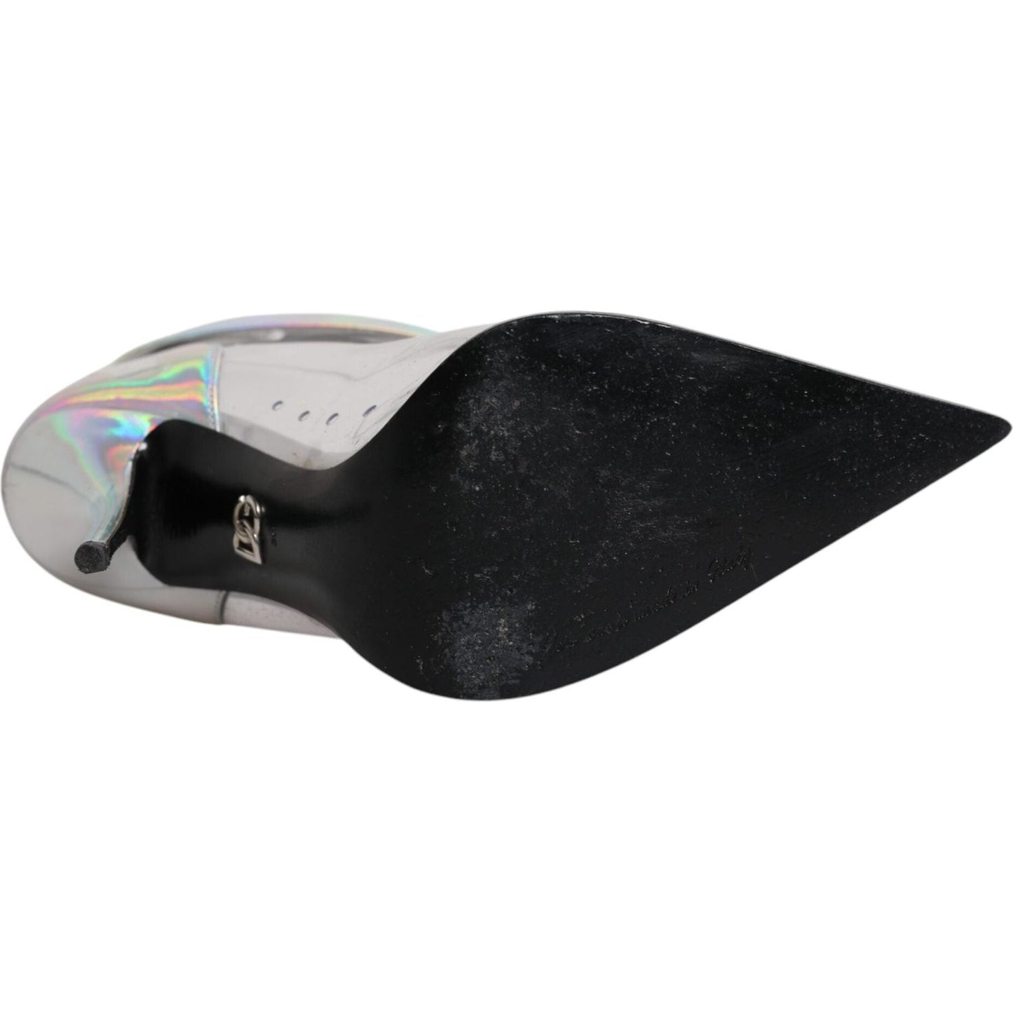 Sole view of Dolce & Gabbana silver iridescent pointed short ankle boots, preowned with visible scratches, leather sole with logo detail