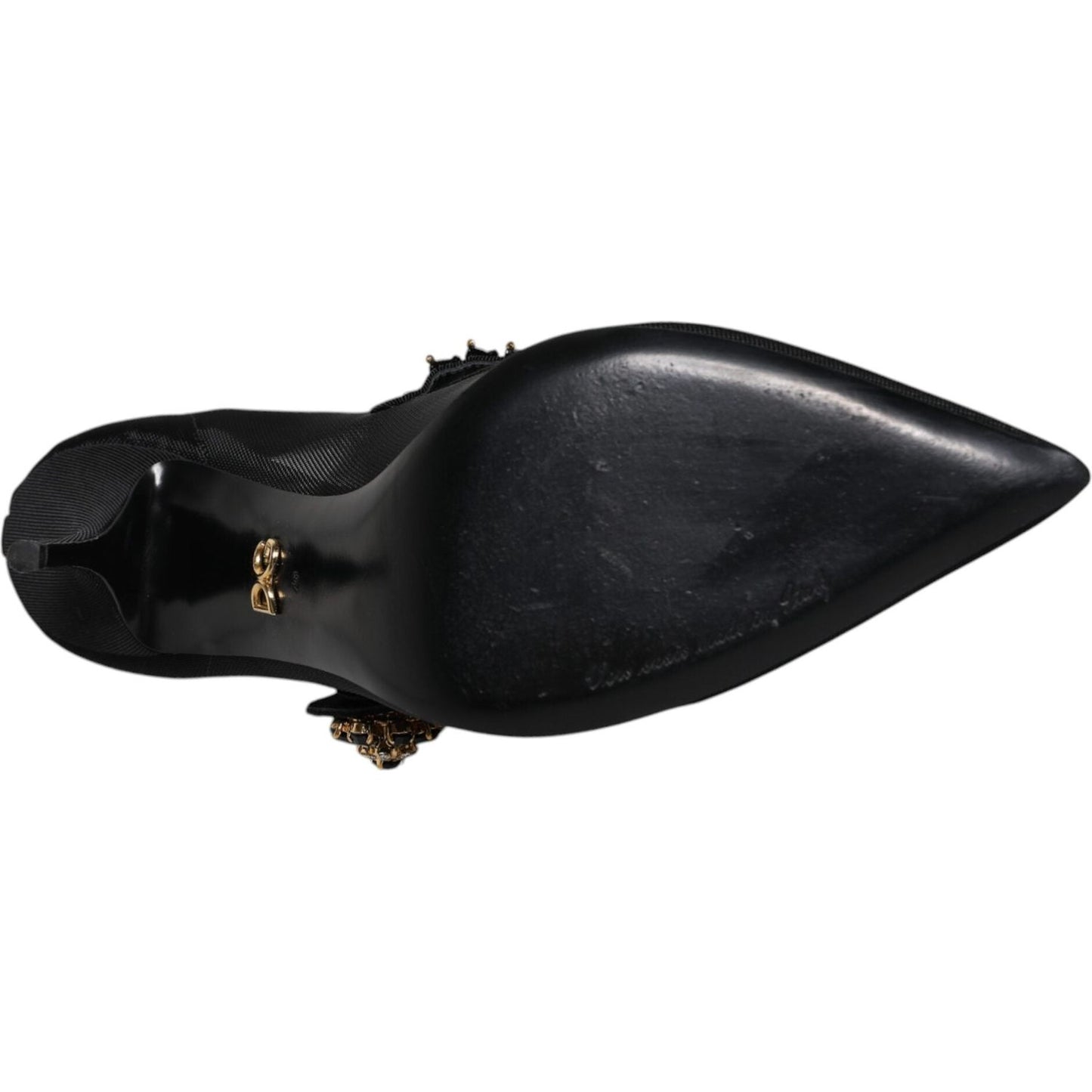 Bottom view of Dolce & Gabbana black mesh Mary Jane pump with crystal heel, featuring leather sole and logo detail, showing minor marks.
