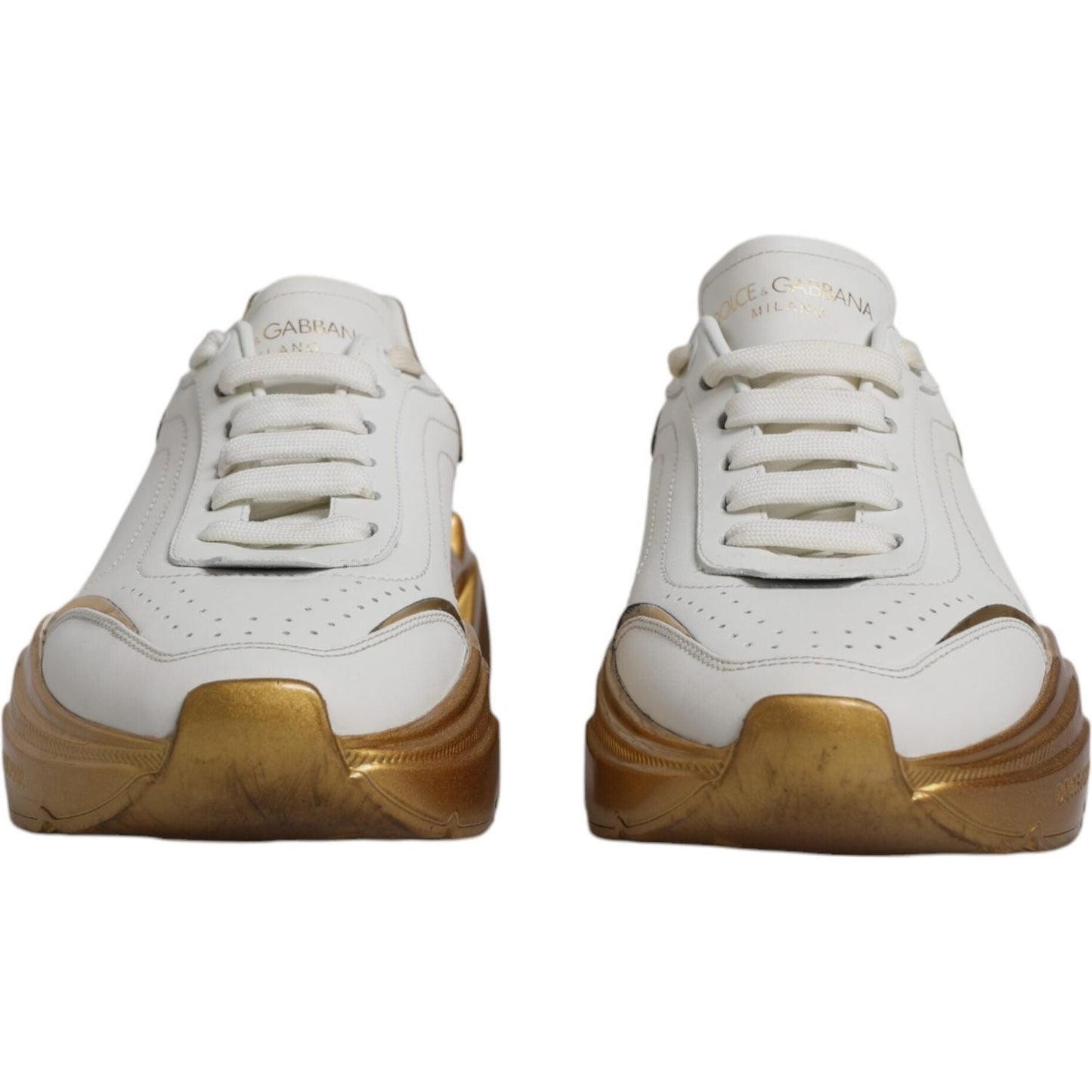 Dolce & Gabbana white and gold Daymaster sneakers, low-top design with lace-up closure and logo details, featuring calf leather and rubber sole.