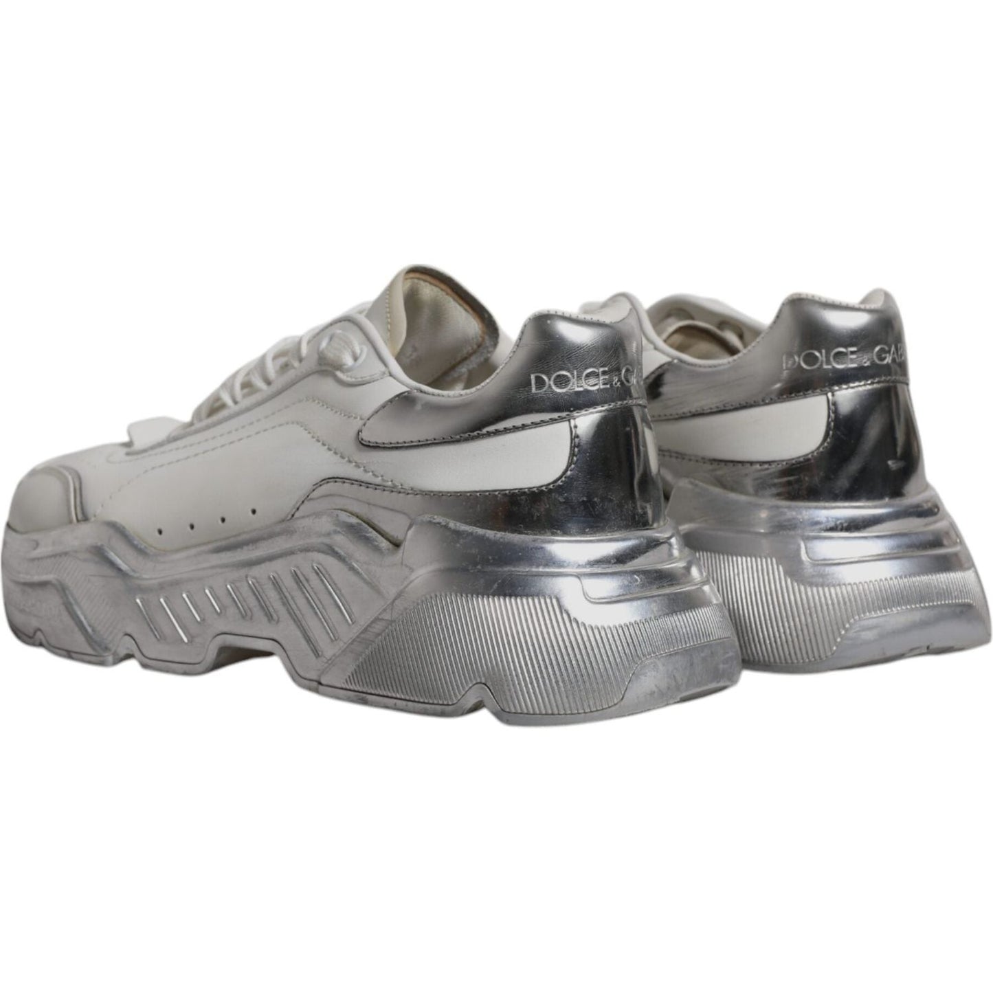Dolce & Gabbana Daymaster sneakers, white and silver calf leather, lace-up, rubber sole, logo details, back view, slightly preowned.