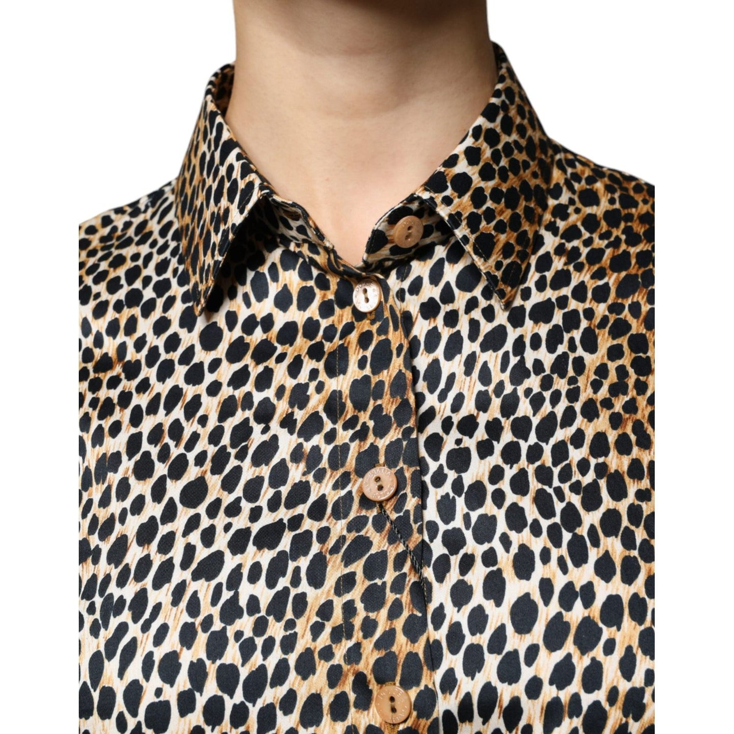 Dolce & Gabbana brown leopard print blouse with short sleeves and button closure, showcasing a close-up of the collared design.