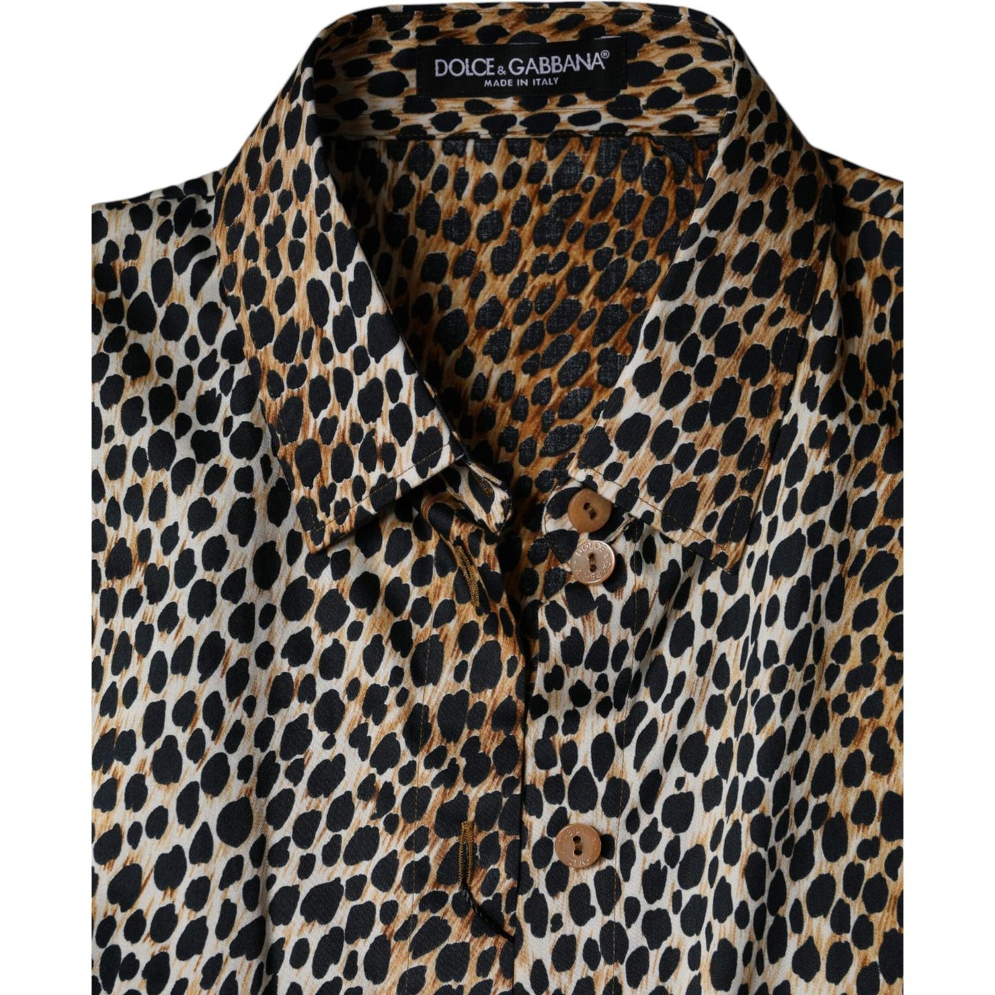 Dolce & Gabbana brown leopard print blouse with short sleeves, button closure, and minor front stains, made of cotton blend.