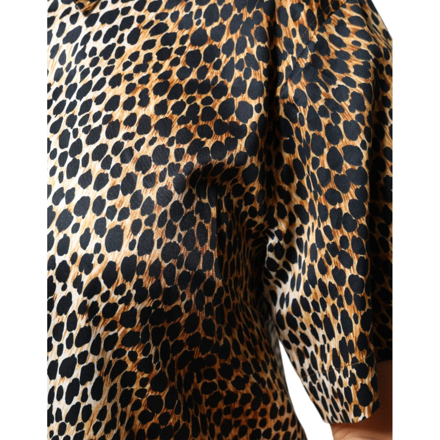 Dolce & Gabbana brown leopard print short sleeve blouse with cotton blend fabric and button closure, featuring logo details.