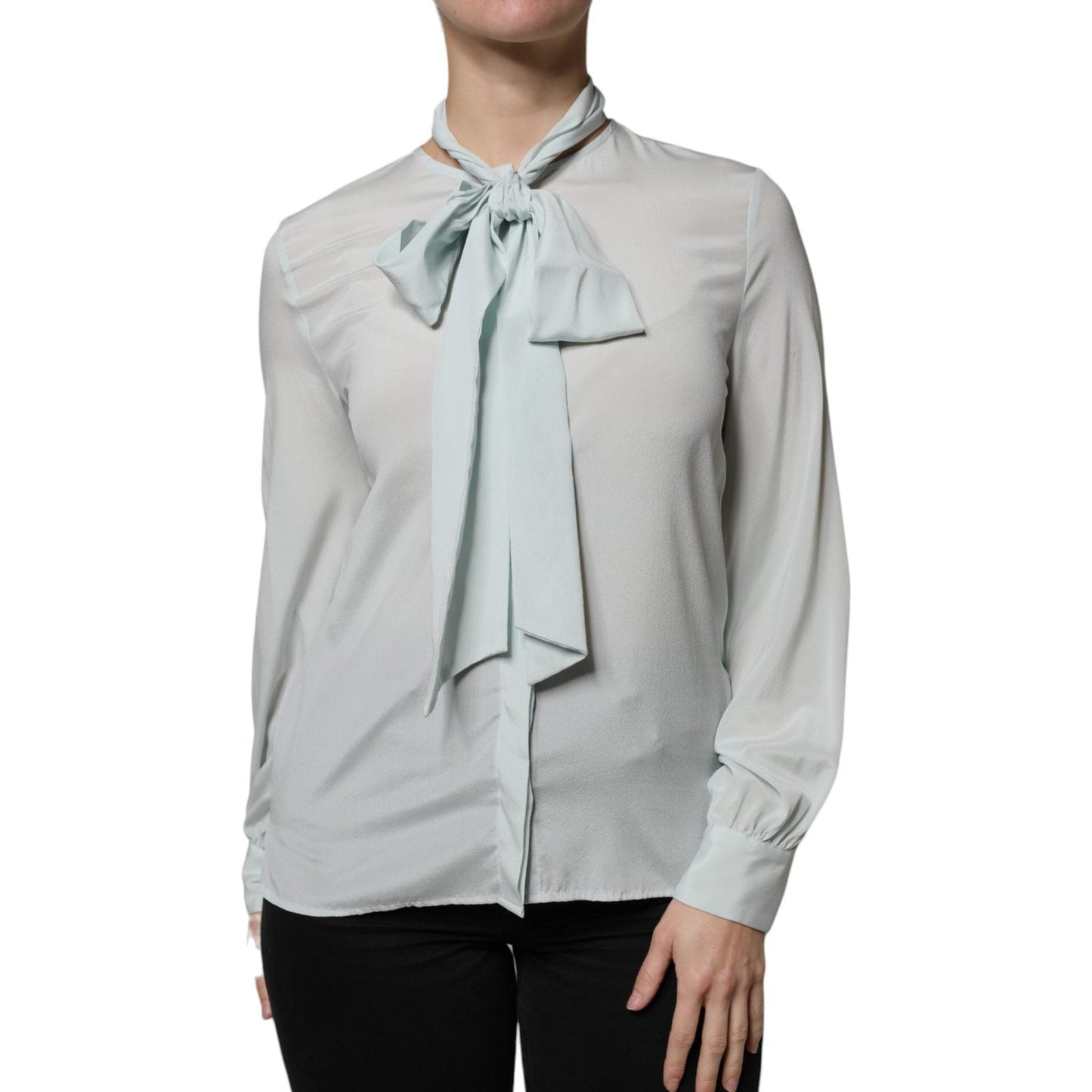 Ballantyne light blue silk ascot top with long sleeves, front view, featuring button closure. Made in Italy, minor stain on back.