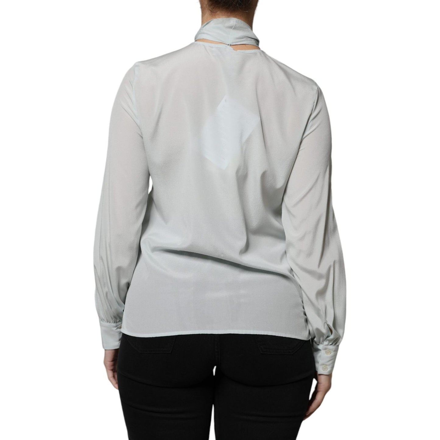 Back view of Ballantyne light blue silk ascot long sleeve top, showing minor stains, button closure, made in Italy.
