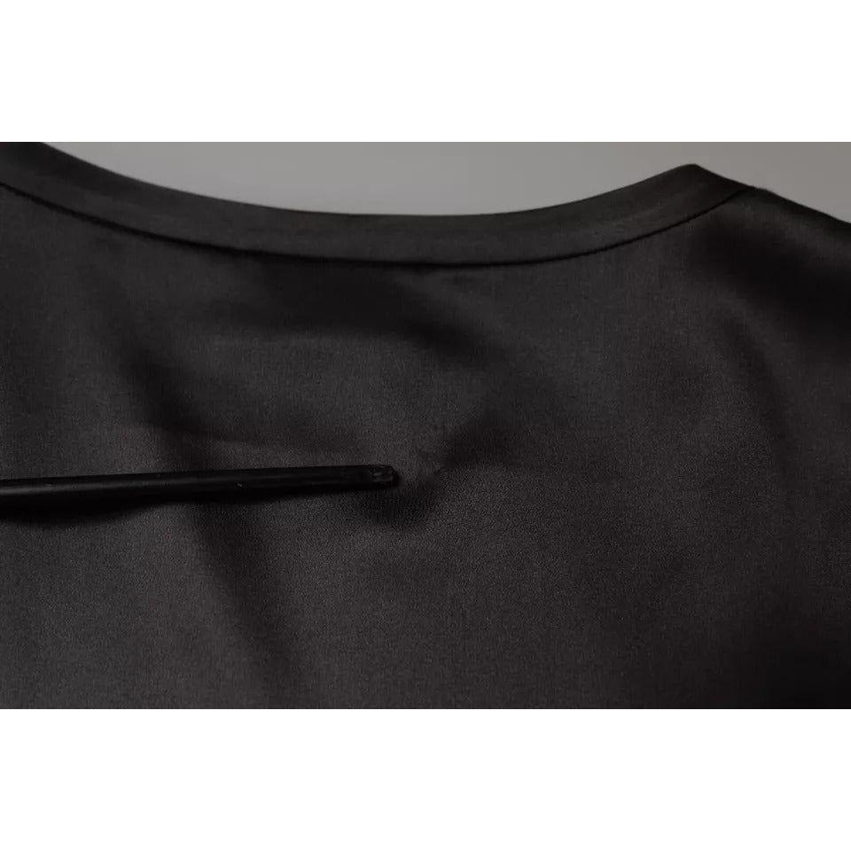 Close-up of black silk blend Brunello Cucinelli sleeveless tank top with minor pulled threads detail on the back.