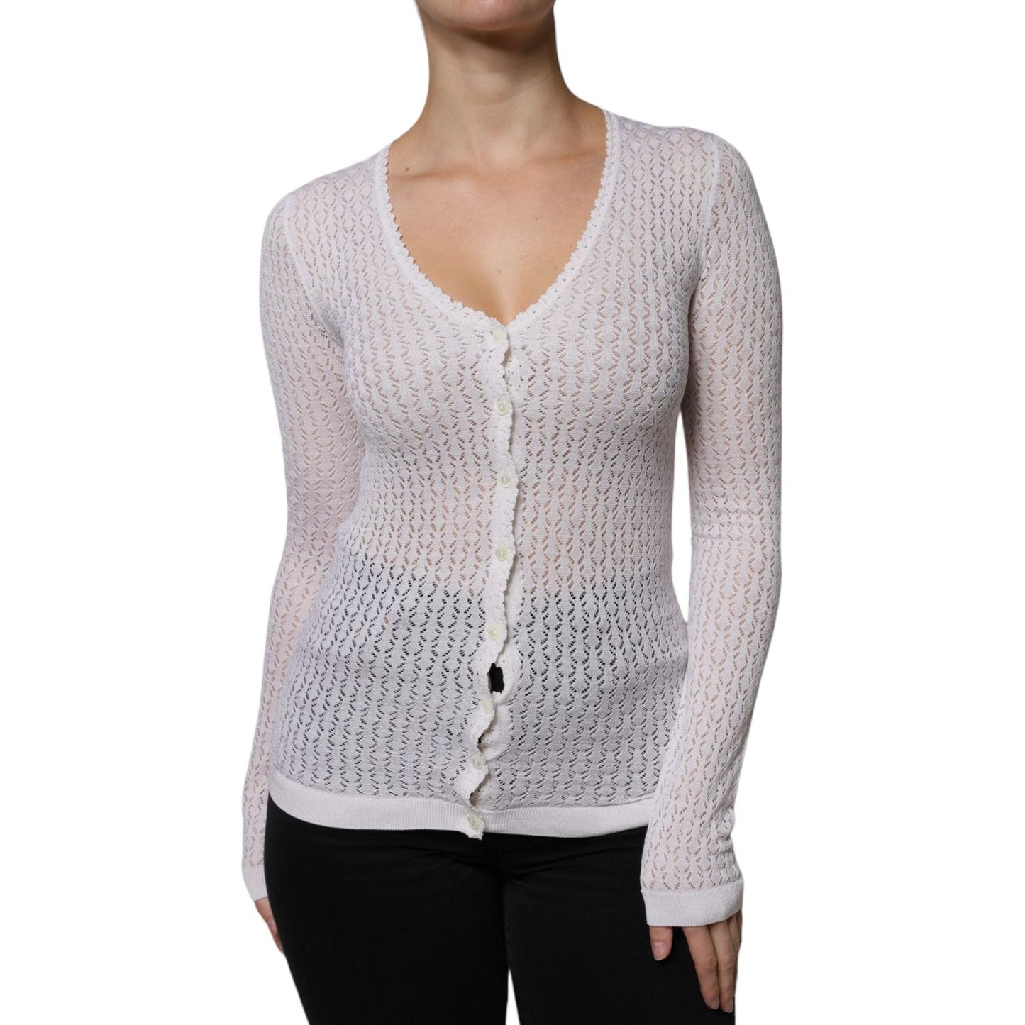 Dolce & Gabbana white silk v-neck cardigan sweater, long sleeves, button down closure, lightweight knit, with minor stain on back.