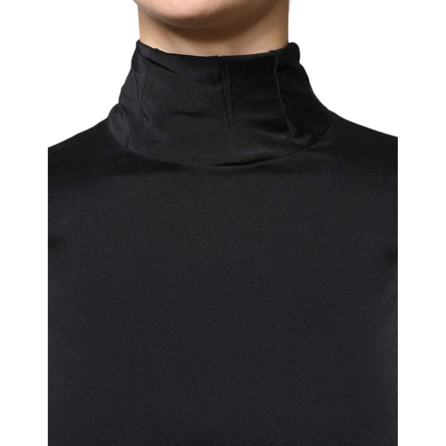 Close-up of Brunello Cucinelli black silk blend blouse with turtle neckline and long sleeves.