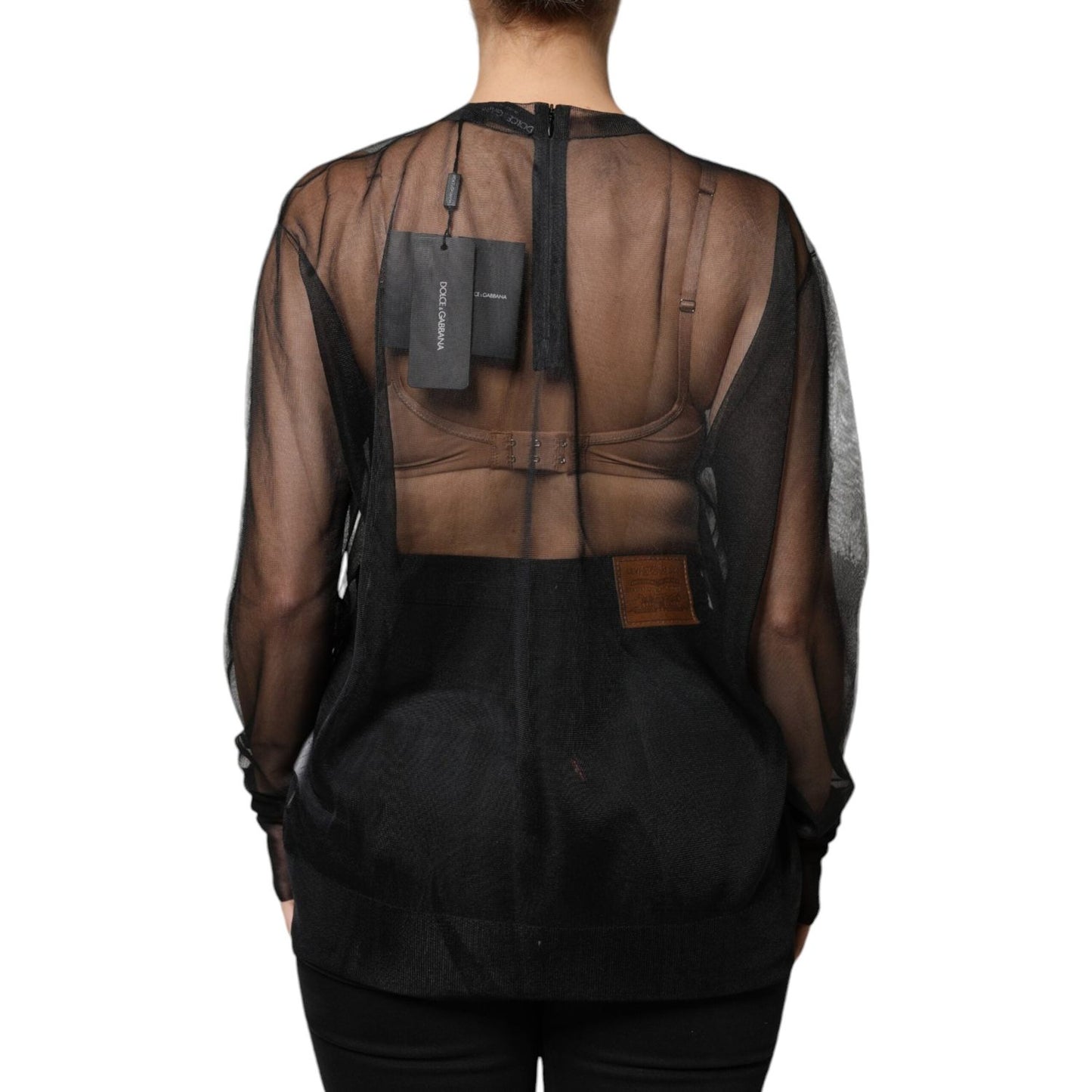 Dolce & Gabbana black sheer long sleeves crewneck blouse with minor defect, showcasing high craftsmanship and logo details.