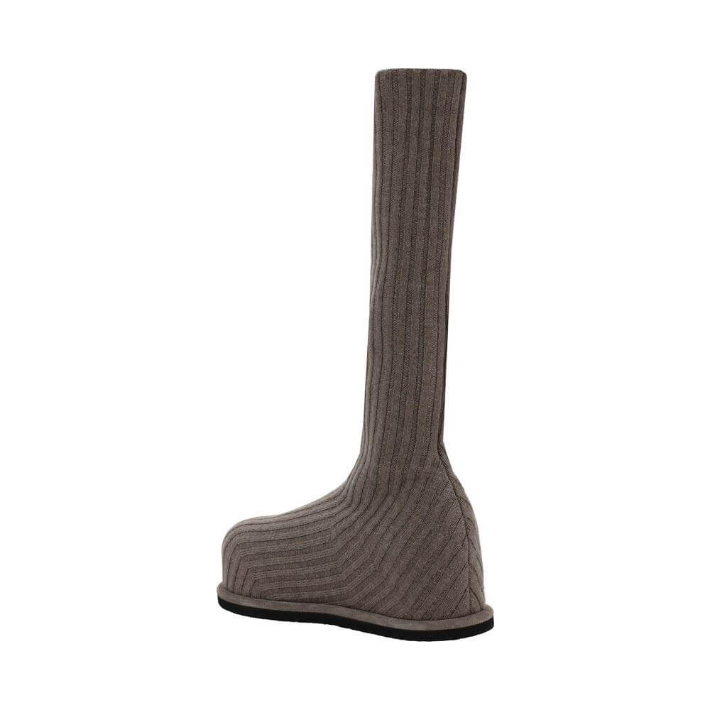 Amina Muaddi Veneda Boots in wool with a ribbed sock effect, featuring a round toe, flat sole, and slip-on style.