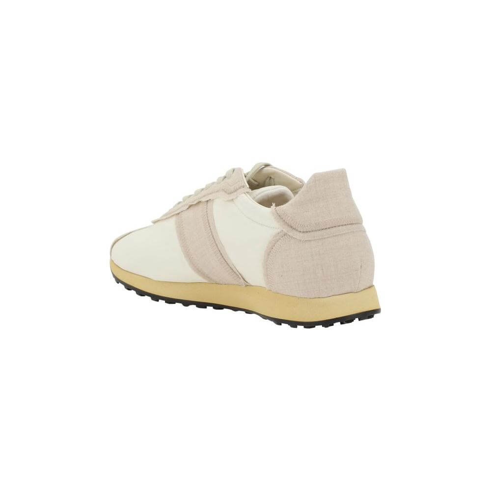 Rear view of The Row Moveo Sneakers showcasing paneled design and flat sole with modern textures.