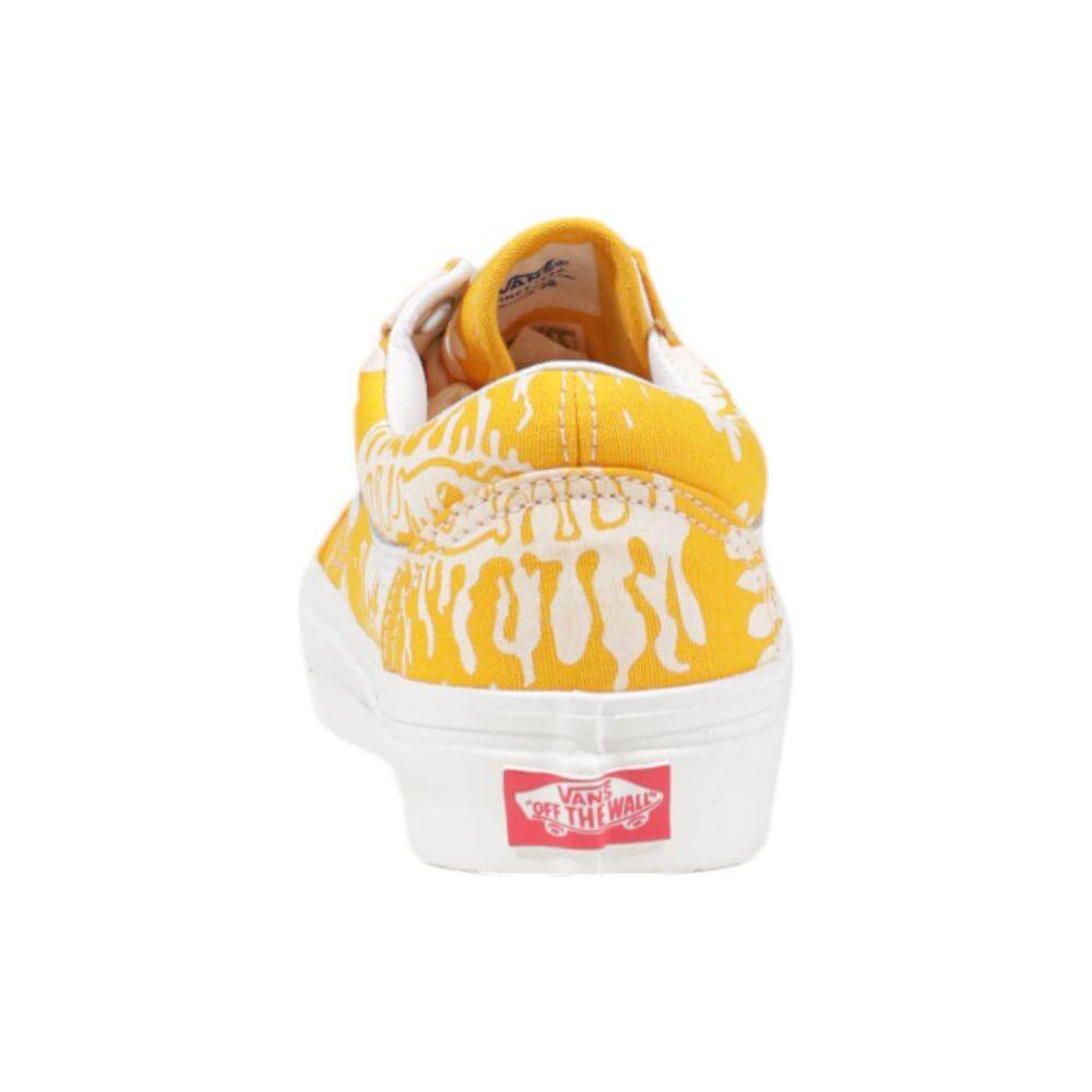 Vans yellow fabric sneaker showcasing back view with iconic 'Off the Wall' logo, featuring stylish textile design and classic silhouette.