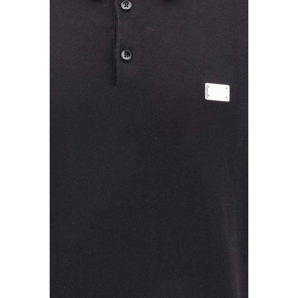 Dolce & Gabbana black polo shirt with buttons, classic collar, and logo hardware detail on chest, perfect for a sleek casual look.