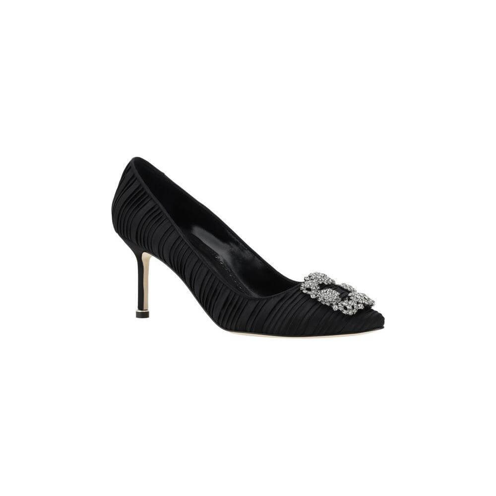 Black Manolo Blahnik Hangisi Pumps with Swarovski crystal buckle and satin finish, featuring a sleek stiletto heel and elegant design.