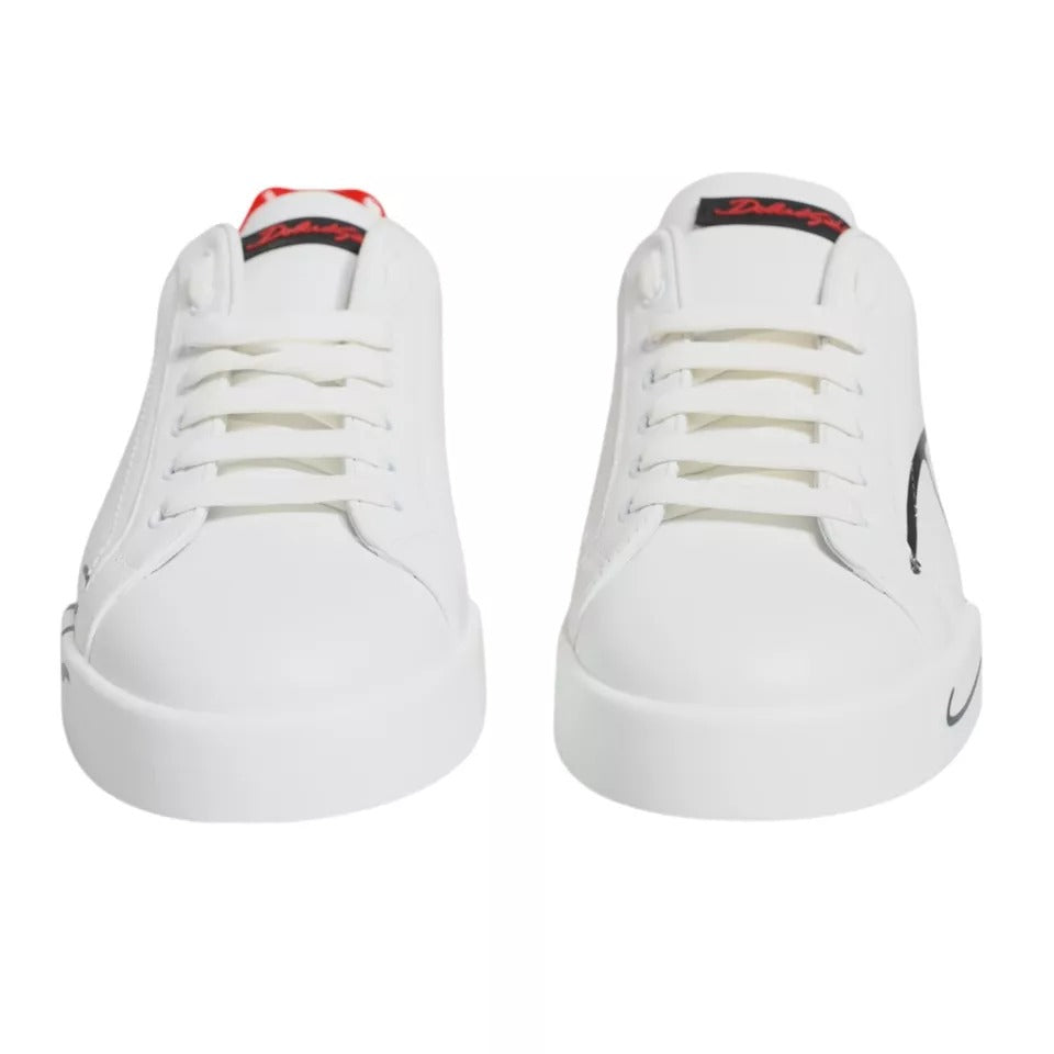 Dolce & Gabbana Portofino low top sneakers in white and red, made from calf leather with rubber soles. Features logo and lace-up closure.