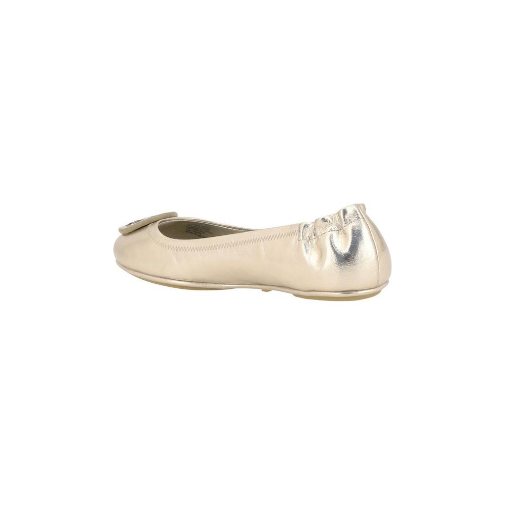 Side view of metallic Tory Burch Minnie Ballerina flat with elasticized heel and iconic logo plaque.