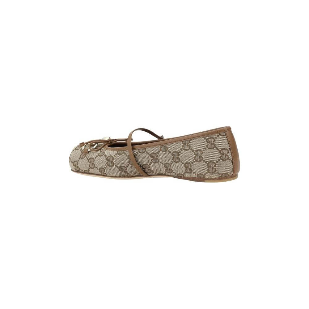 Gucci GG Ballerinas with square toe, bow detail, and buckle strap in iconic canvas design
