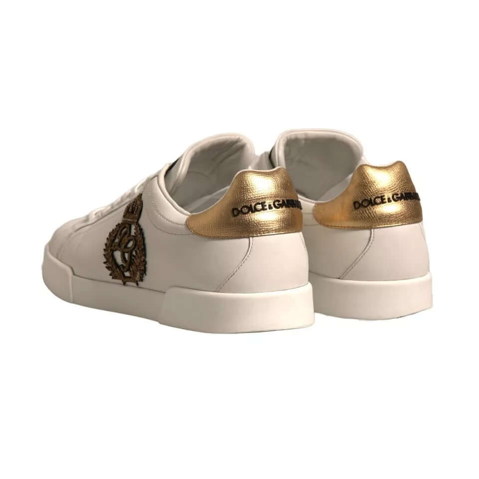 Dolce & Gabbana Portofino white sneakers with gold-tone leather heel counter and crown patch, luxury calfskin design.