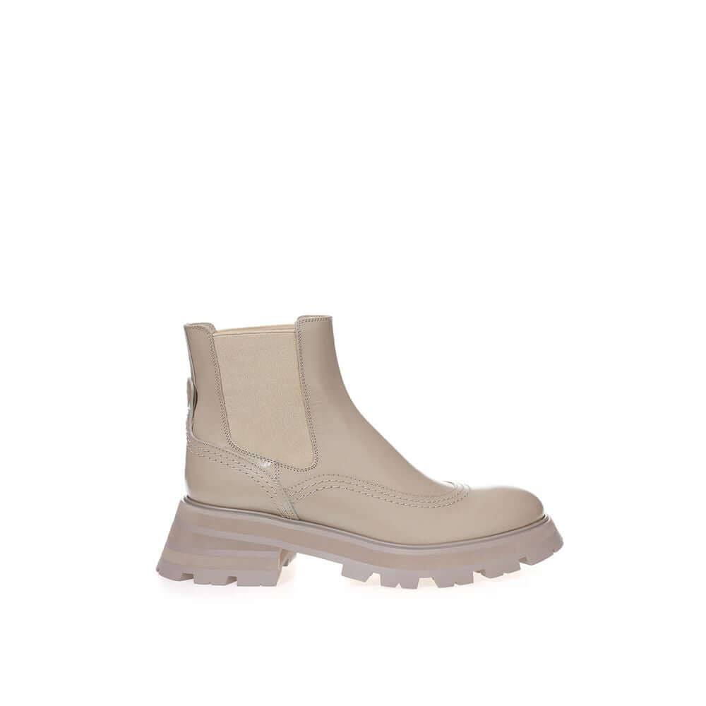 Chic gray leather boots by Alexander McQueen, showcasing a modern silhouette and elegant design for sophisticated fashion statements.